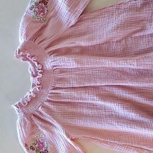 Pink smocked collar dress with embroidered flowers on sleeves.  Size 6